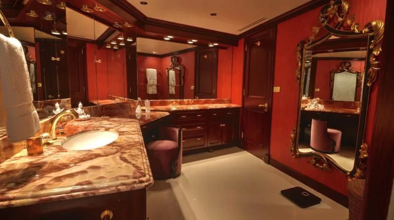 a bathroom with a large mirror aboard SCORPIO Yacht for Sale