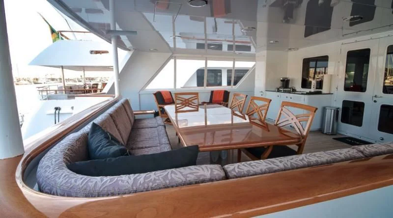 a living room with a couch and a table aboard SCORPIO Yacht for Sale