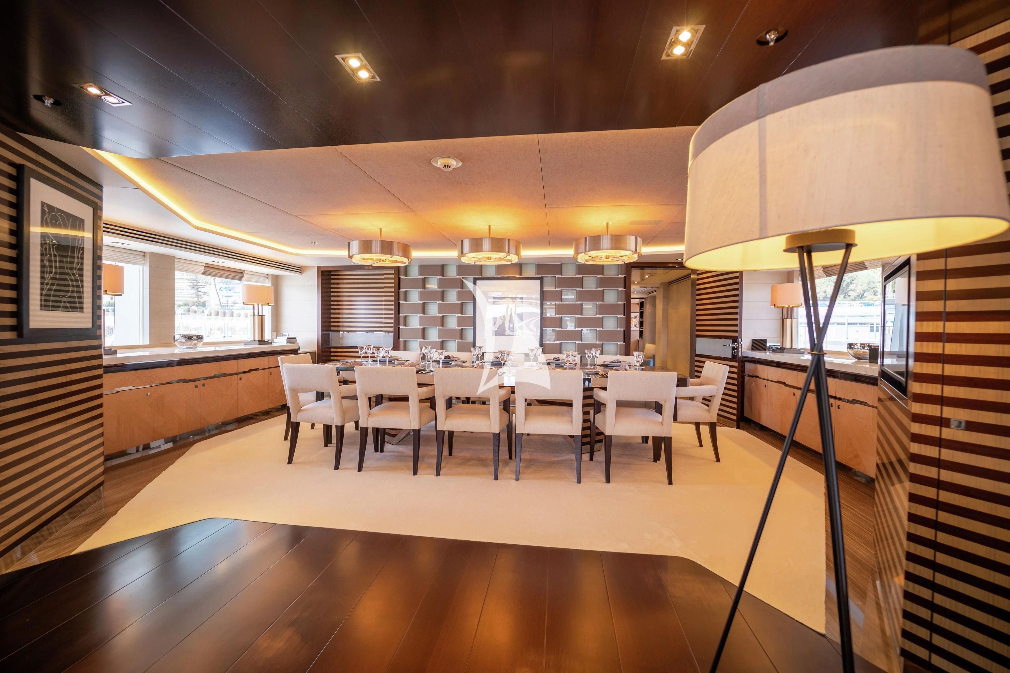 a room with a table and chairs aboard ILLUSION Yacht for Sale