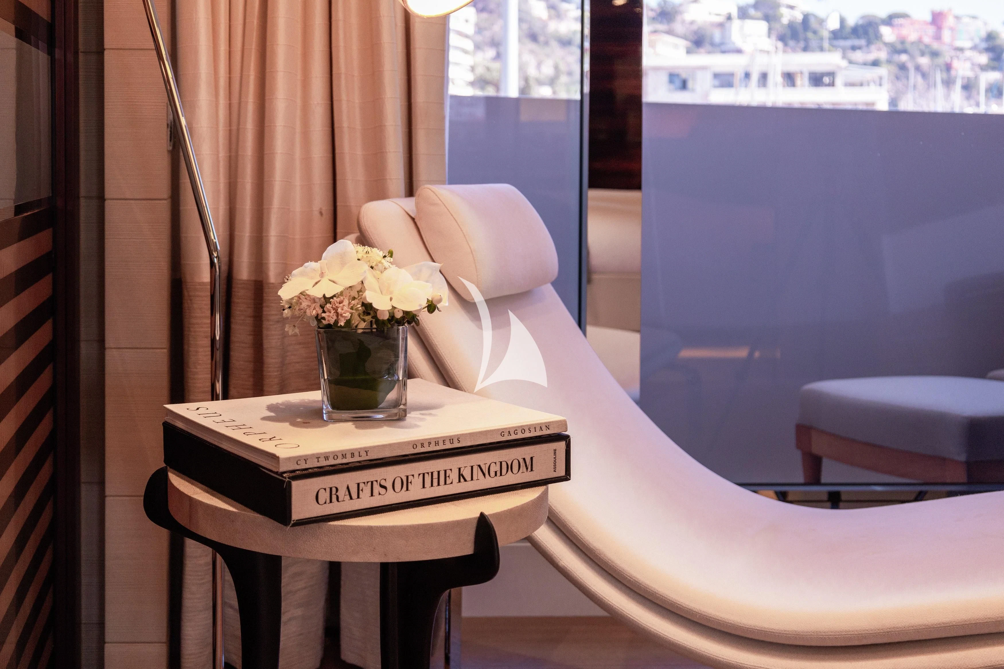 a vase of flowers on a table aboard ILLUSION Yacht for Sale