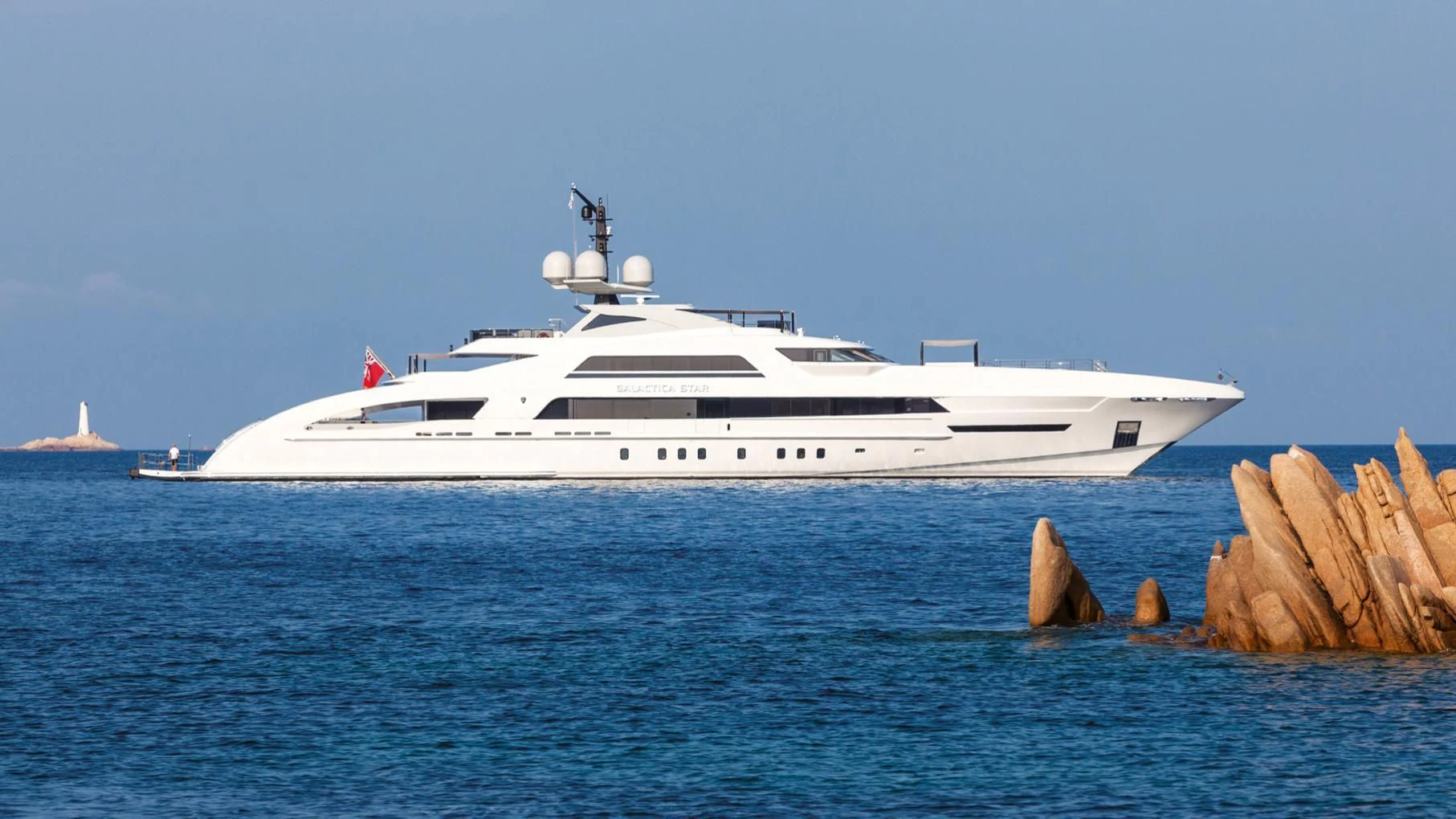 a white yacht in the water aboard ILLUSION Yacht for Sale