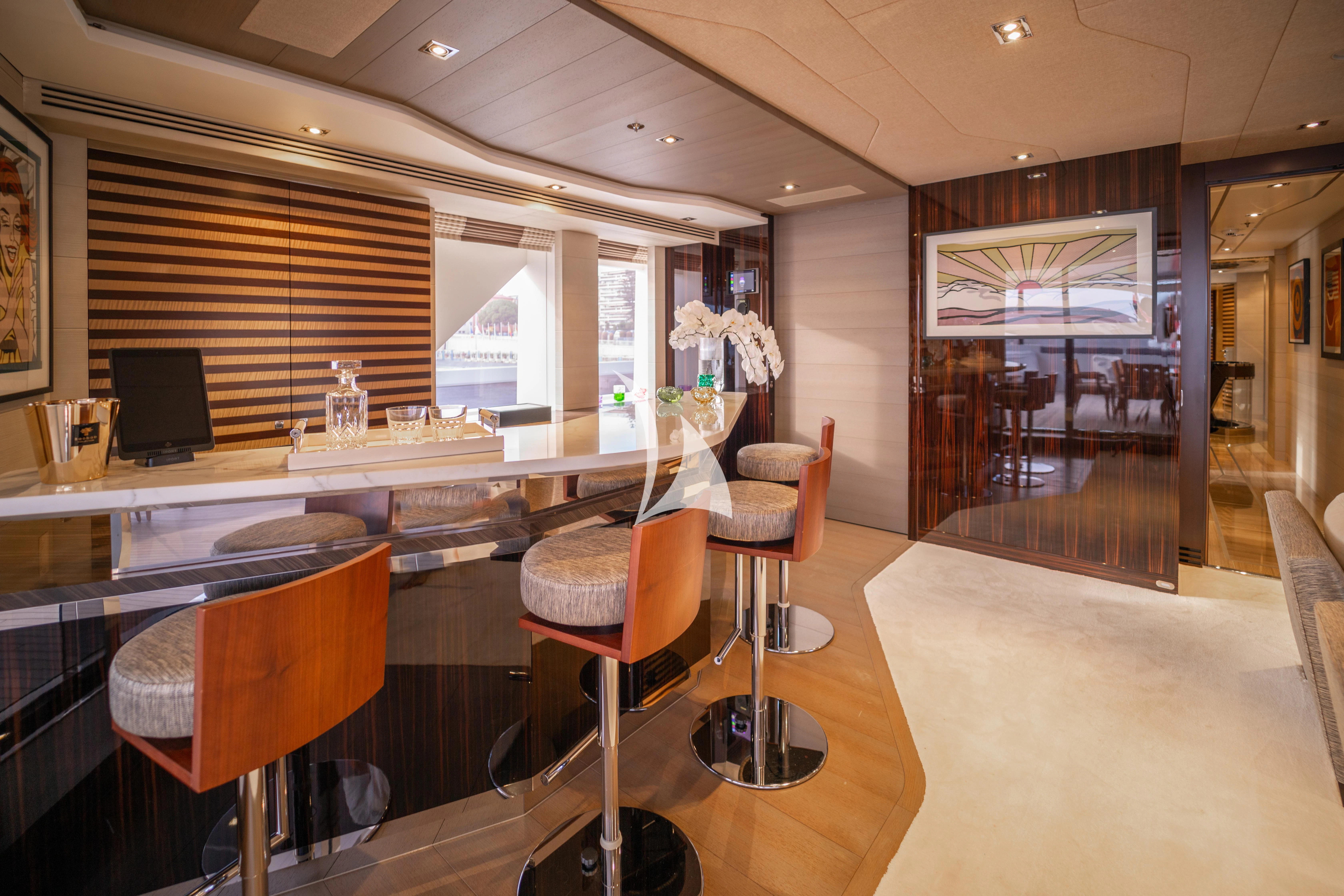 a room with a desk and chairs aboard ILLUSION Yacht for Sale