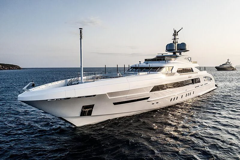 a large white ship in the water aboard ILLUSION Yacht for Sale