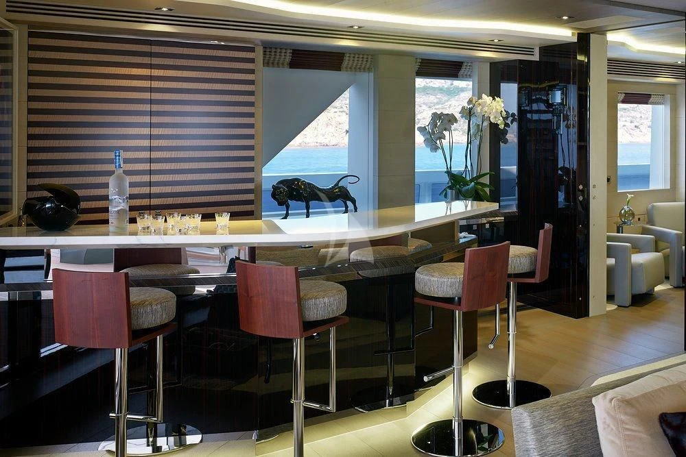 a kitchen with a table and chairs aboard ILLUSION Yacht for Sale