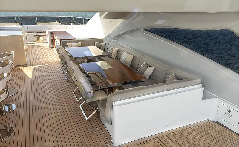 a room with a bed and a desk aboard ILLUSION Yacht for Sale