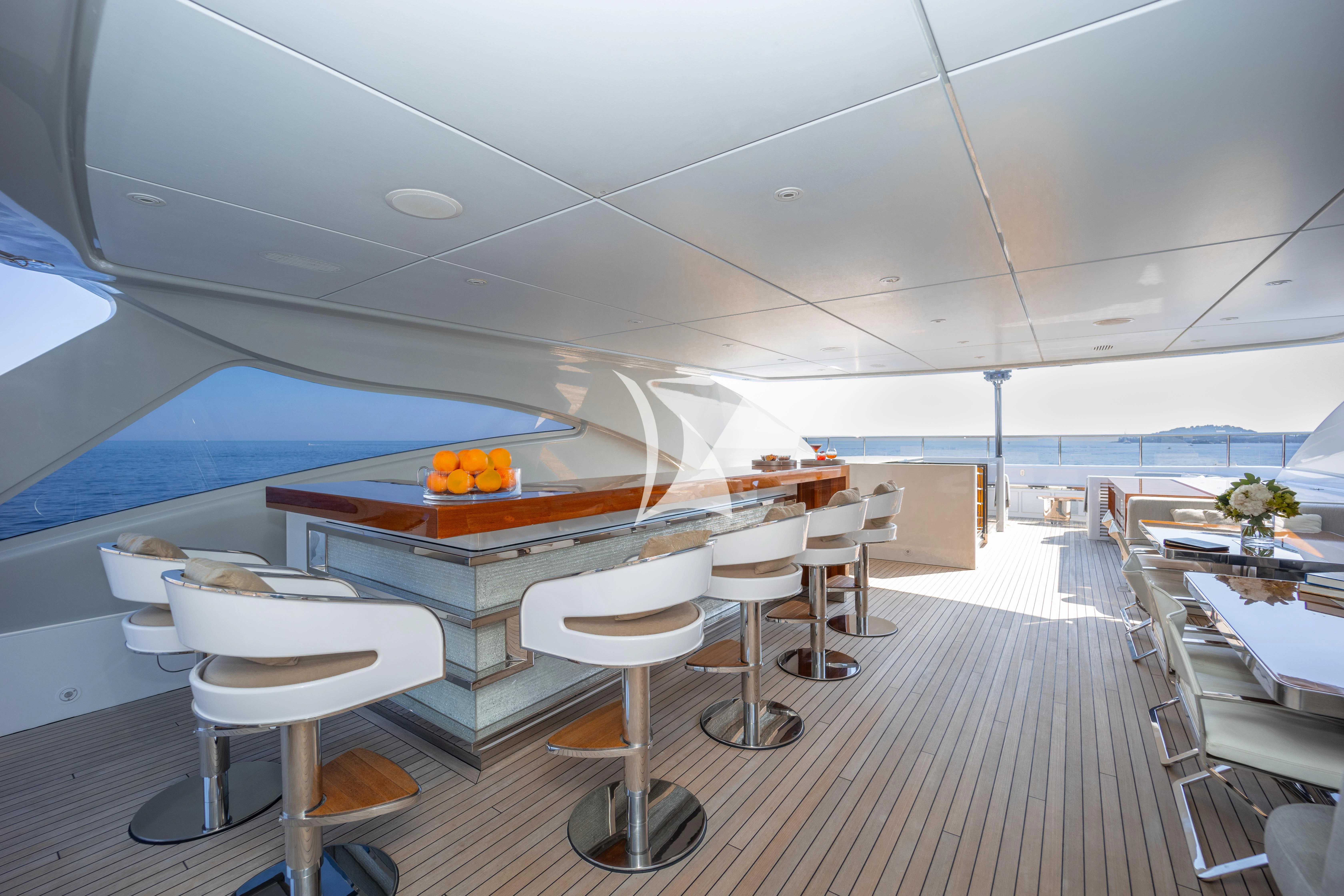a room with a table and chairs aboard ILLUSION Yacht for Sale