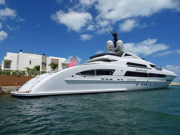 a white yacht in the water aboard ILLUSION Yacht for Sale