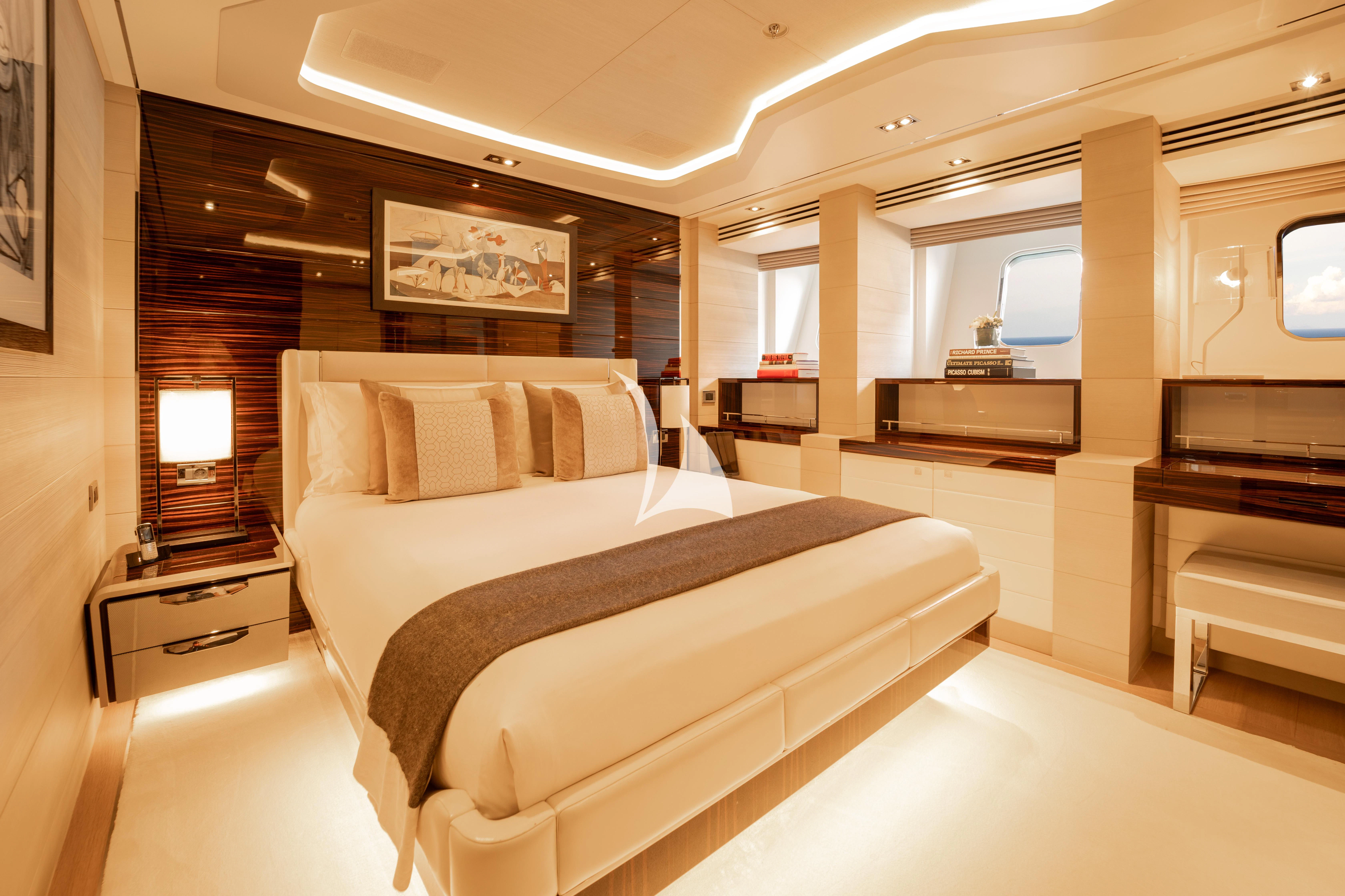 a large bedroom with a large bed aboard ILLUSION Yacht for Sale