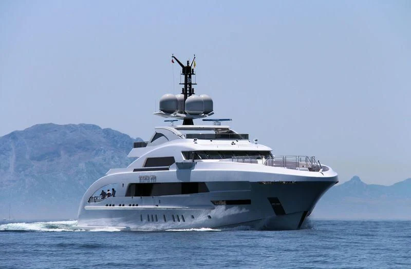 a large white boat in the water aboard ILLUSION Yacht for Sale