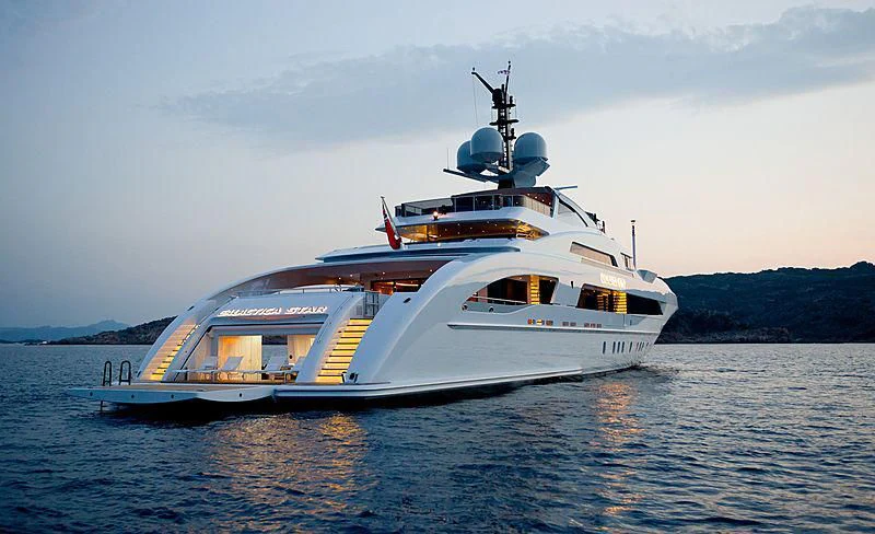 a large white boat in the water aboard ILLUSION Yacht for Sale