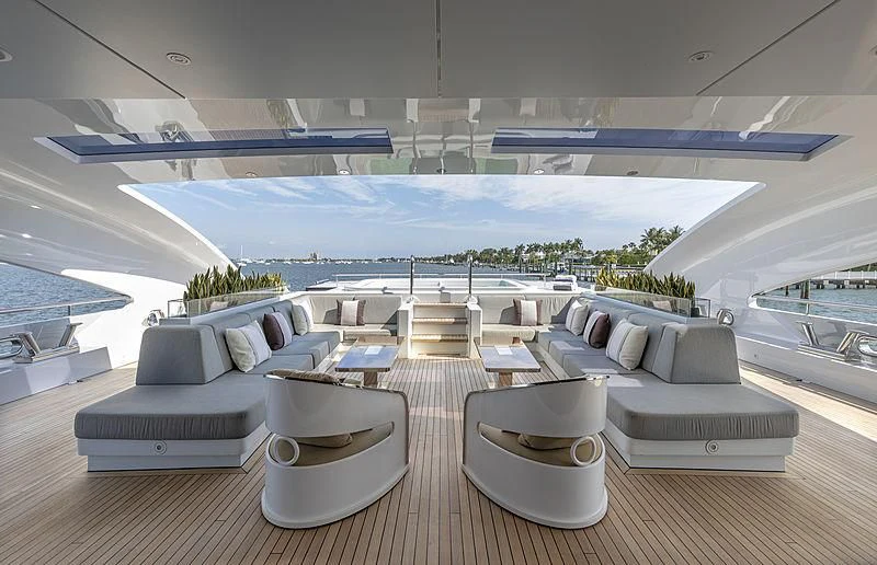 a modern living room with a pool aboard ILLUSION Yacht for Sale
