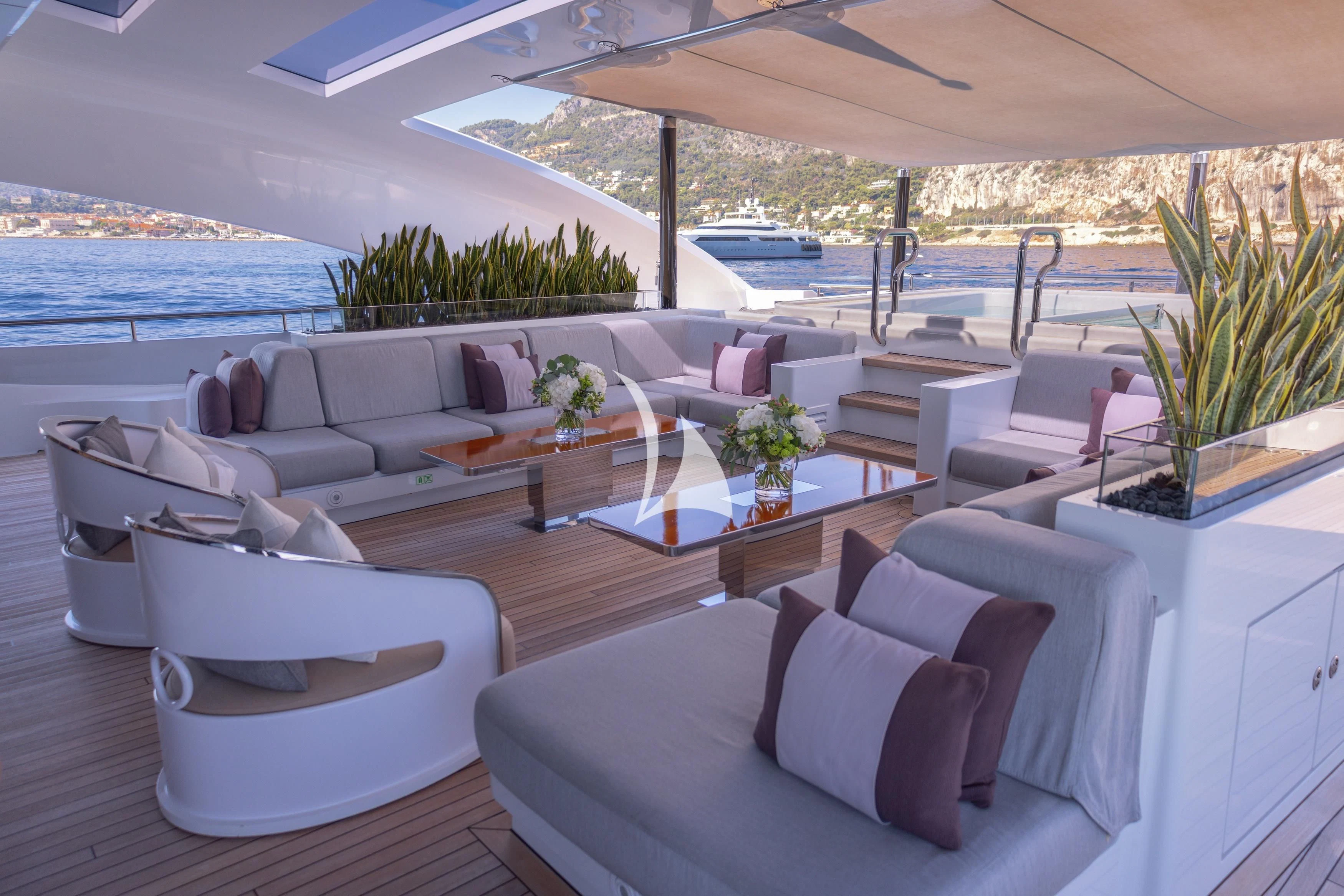 a living room with a large patio aboard ILLUSION Yacht for Sale