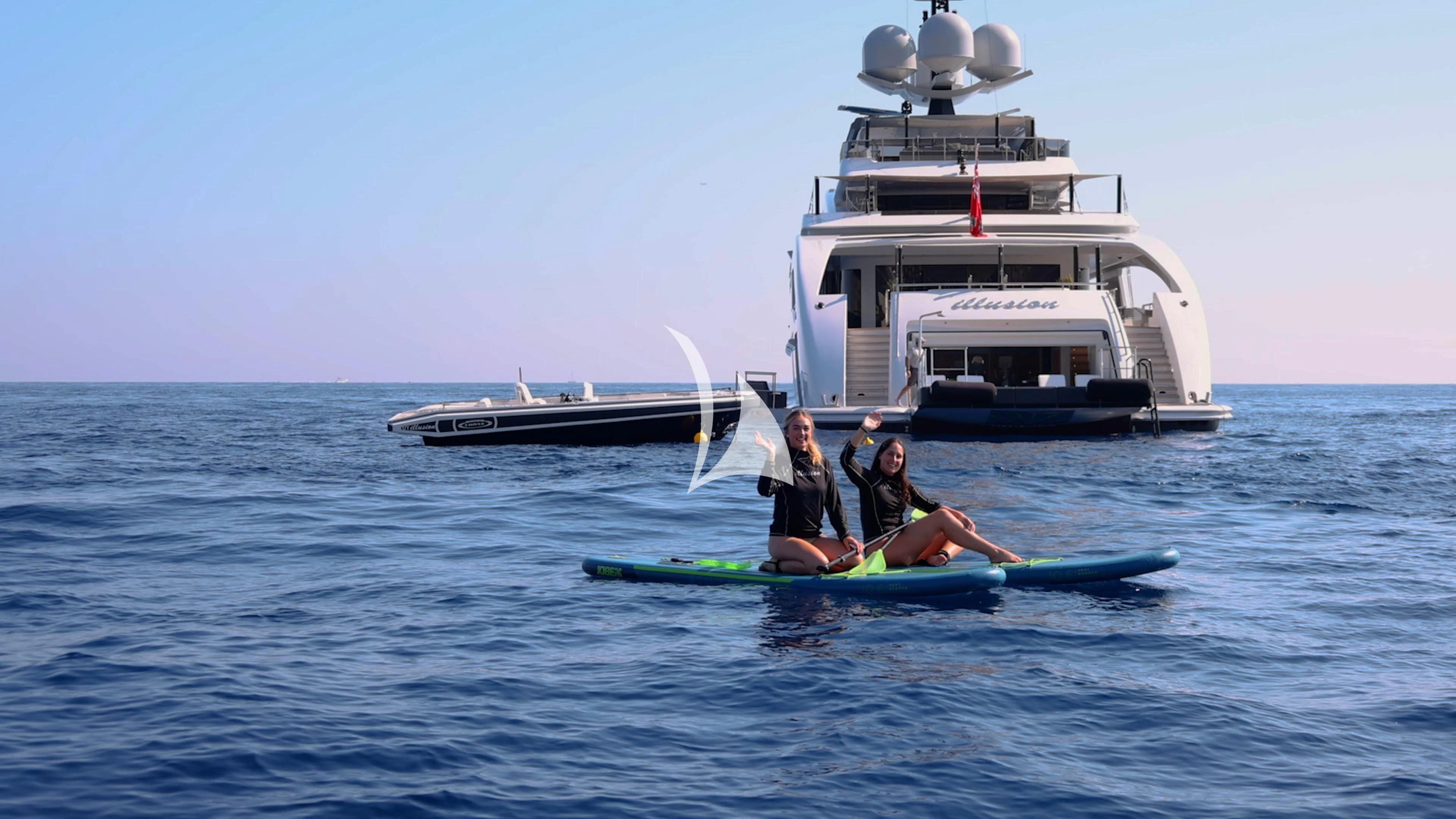 a group of people on a boat in the water aboard ILLUSION Yacht for Sale