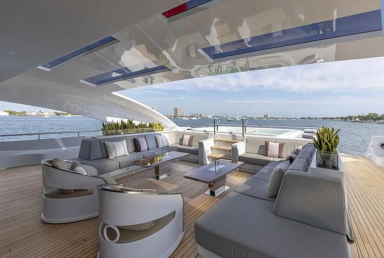 a living room with a large balcony aboard ILLUSION Yacht for Sale