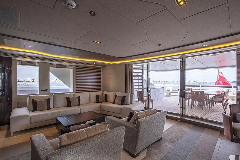a living room with a large window aboard ILLUSION Yacht for Sale
