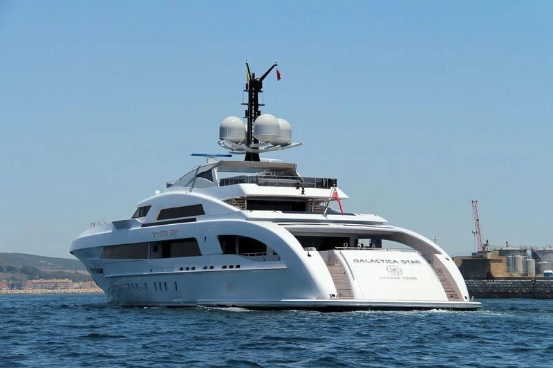 a white yacht in the water aboard ILLUSION Yacht for Sale