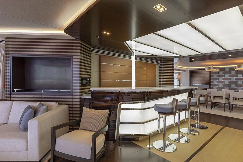 a room with a couch and a tv aboard ILLUSION Yacht for Sale