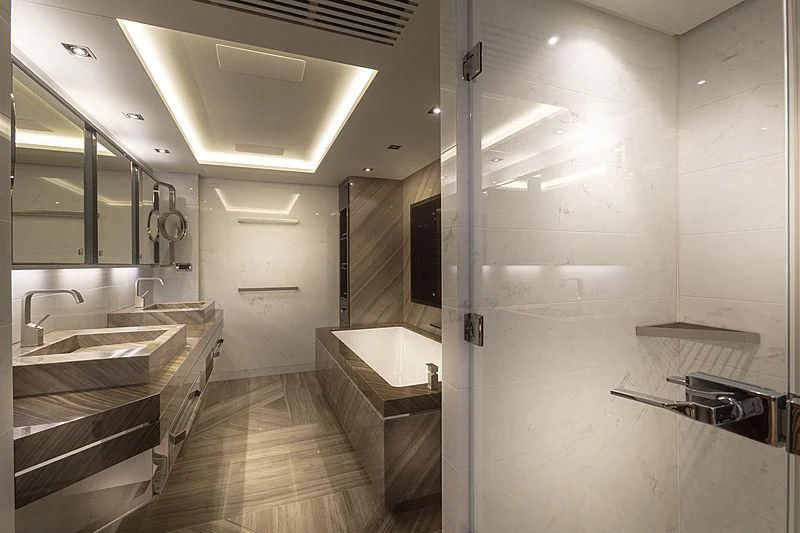 a bathroom with a large tub aboard ILLUSION Yacht for Sale