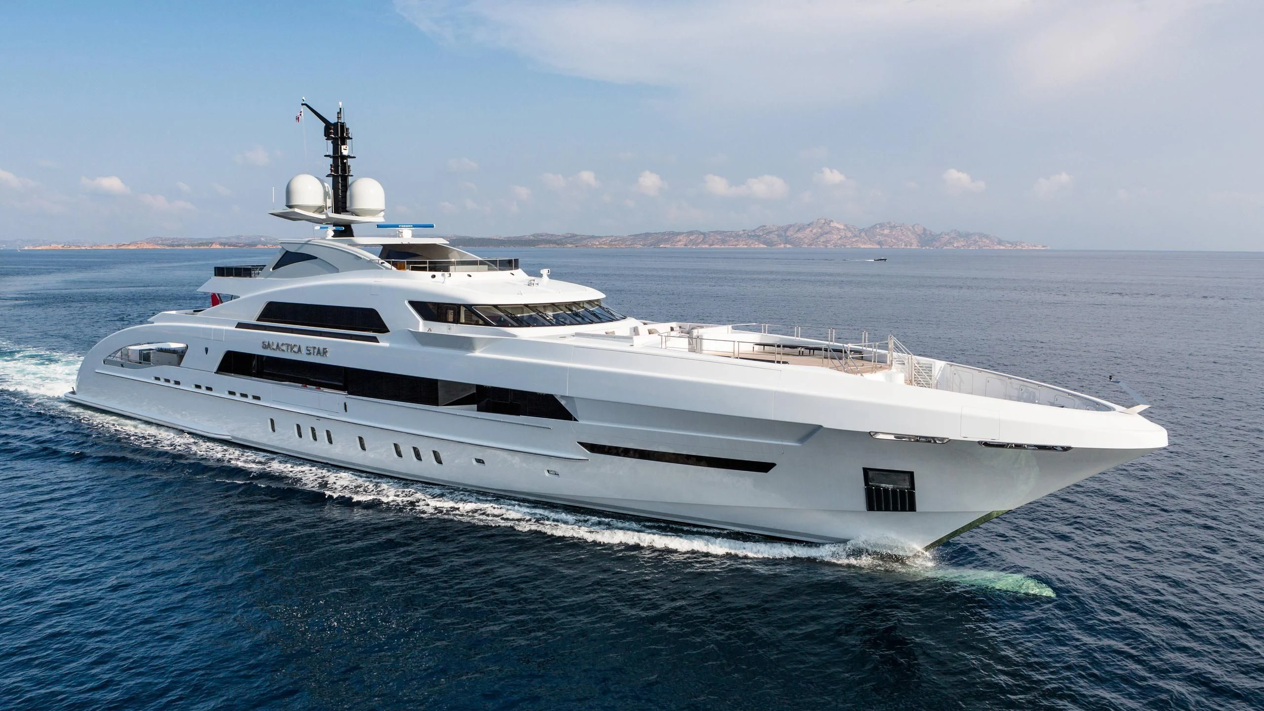 a white yacht in the water aboard ILLUSION Yacht for Sale