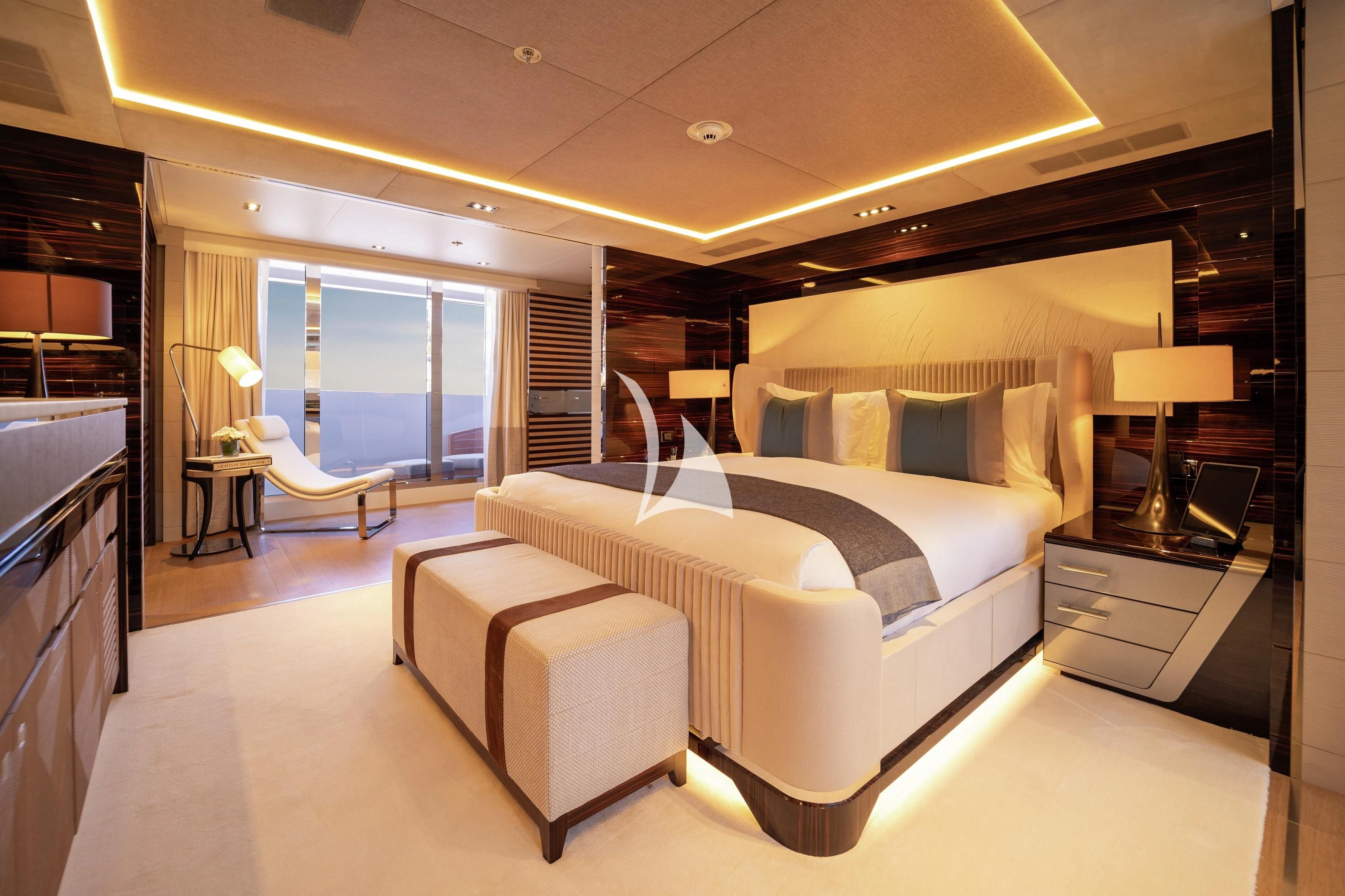a large bedroom with a large bed aboard ILLUSION Yacht for Sale
