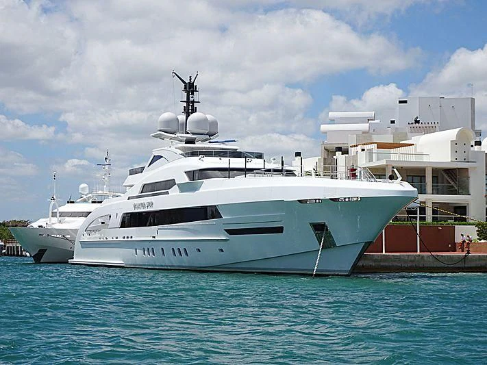 a white yacht in the water aboard ILLUSION Yacht for Sale