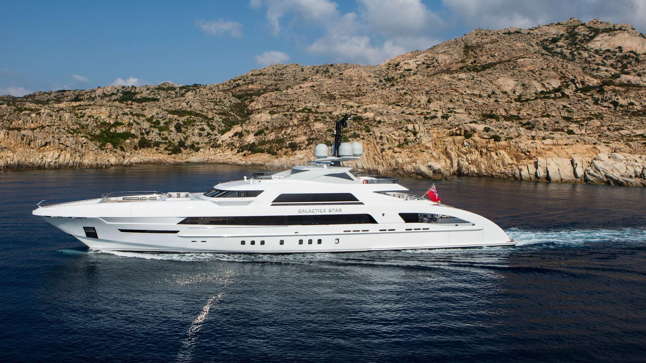 a white yacht on the water aboard ILLUSION Yacht for Sale