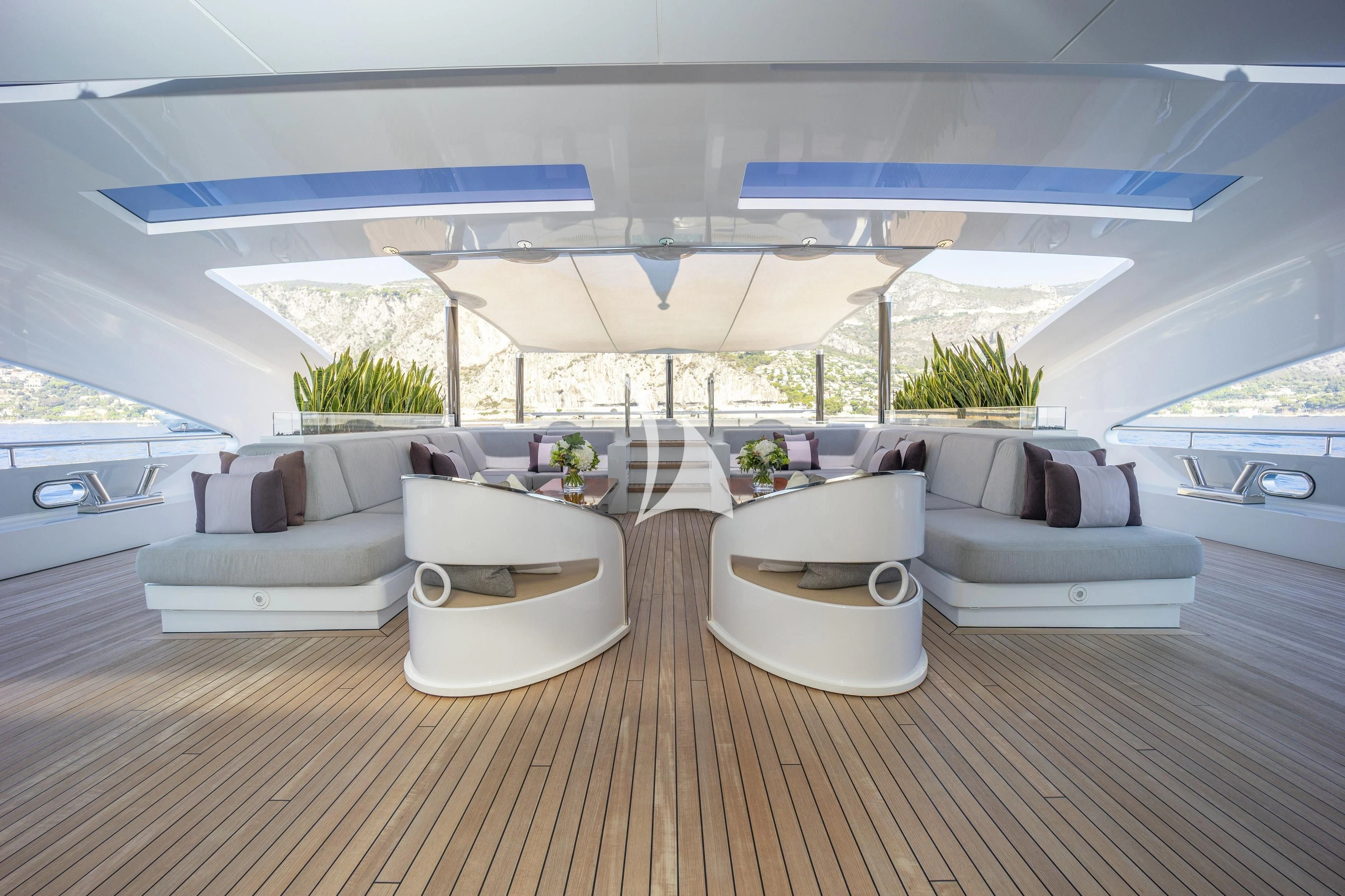 a living room with a large patio aboard ILLUSION Yacht for Sale