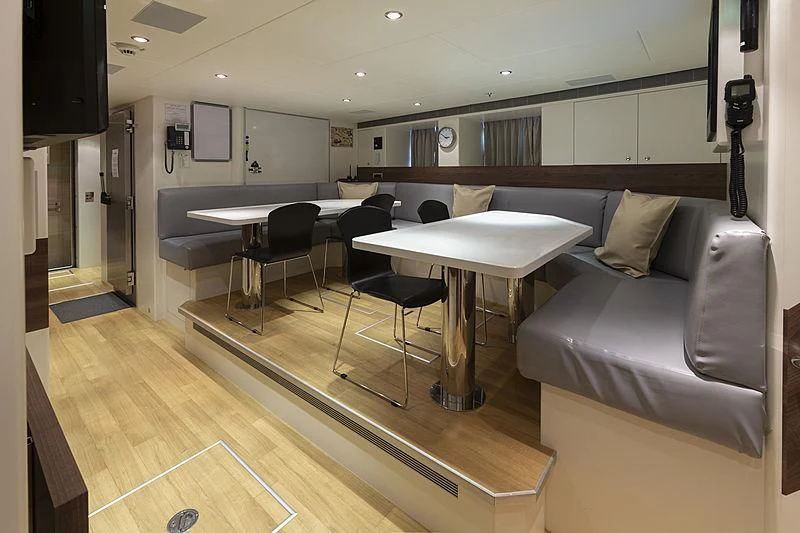 a room with a couch and a table aboard ILLUSION Yacht for Sale