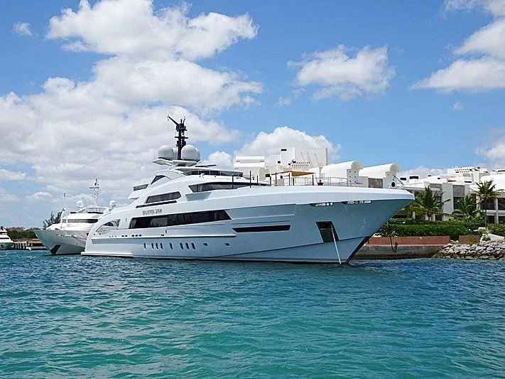 a white yacht in the water aboard ILLUSION Yacht for Sale