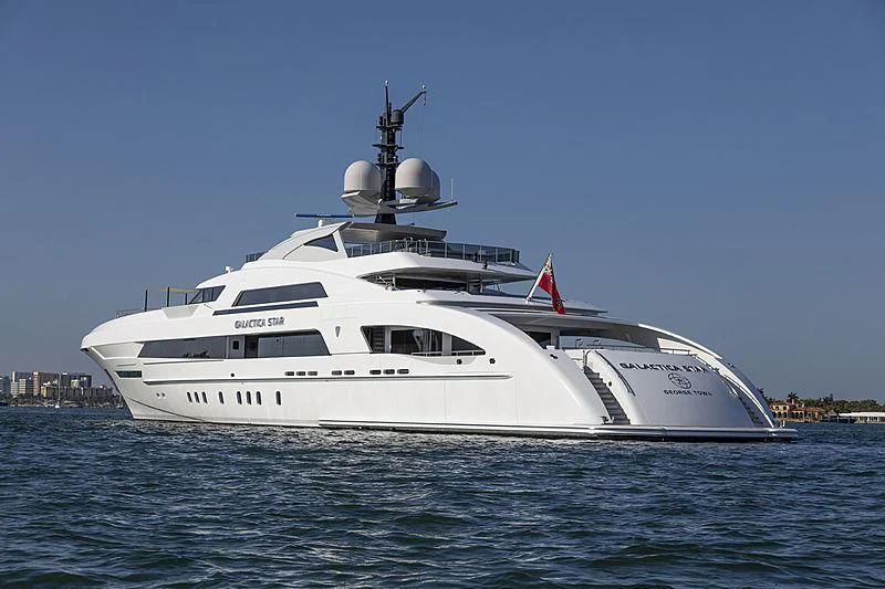 a white yacht on the water aboard ILLUSION Yacht for Sale