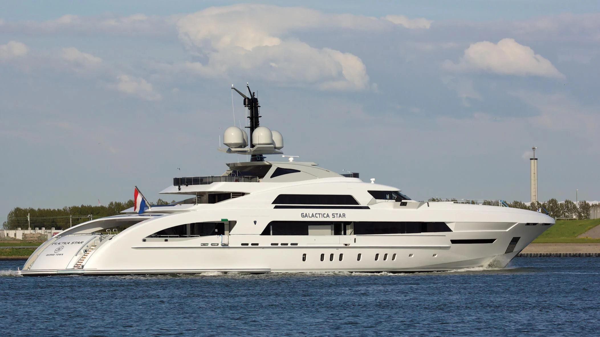 a large white yacht aboard ILLUSION Yacht for Sale