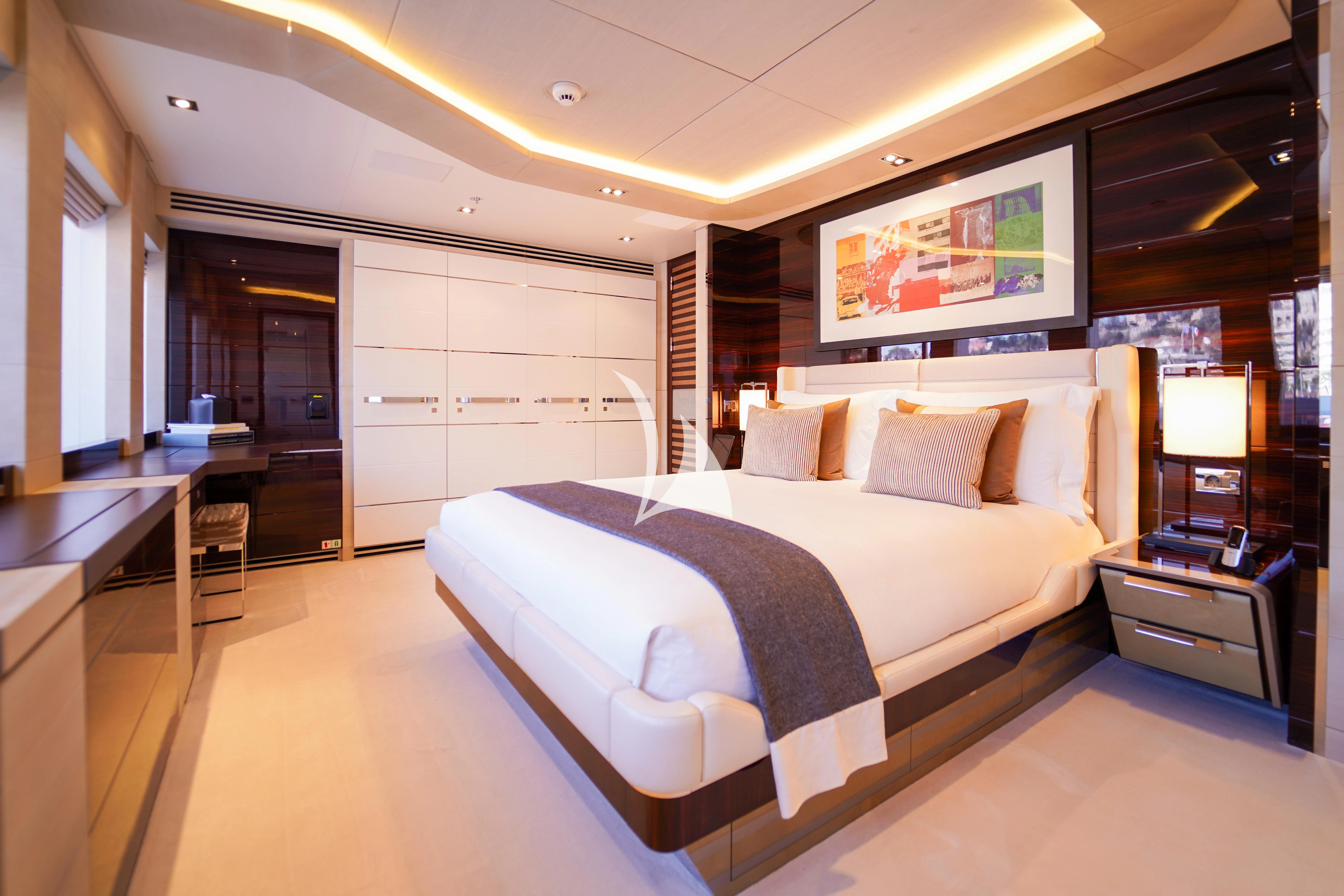 a large bed in a hotel room aboard ILLUSION Yacht for Sale