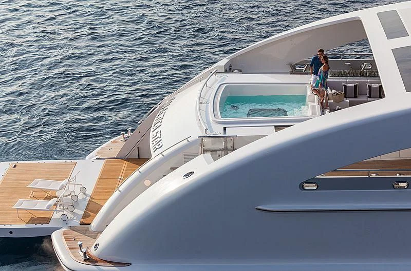 a person standing on a boat aboard ILLUSION Yacht for Sale