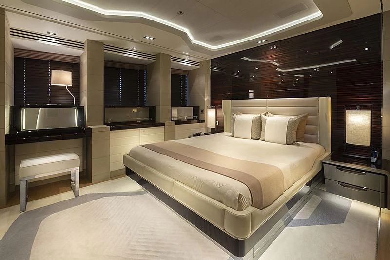 a large bed in a room aboard ILLUSION Yacht for Sale