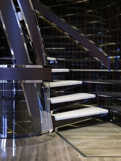 a set of white chairs in a warehouse aboard ILLUSION Yacht for Sale