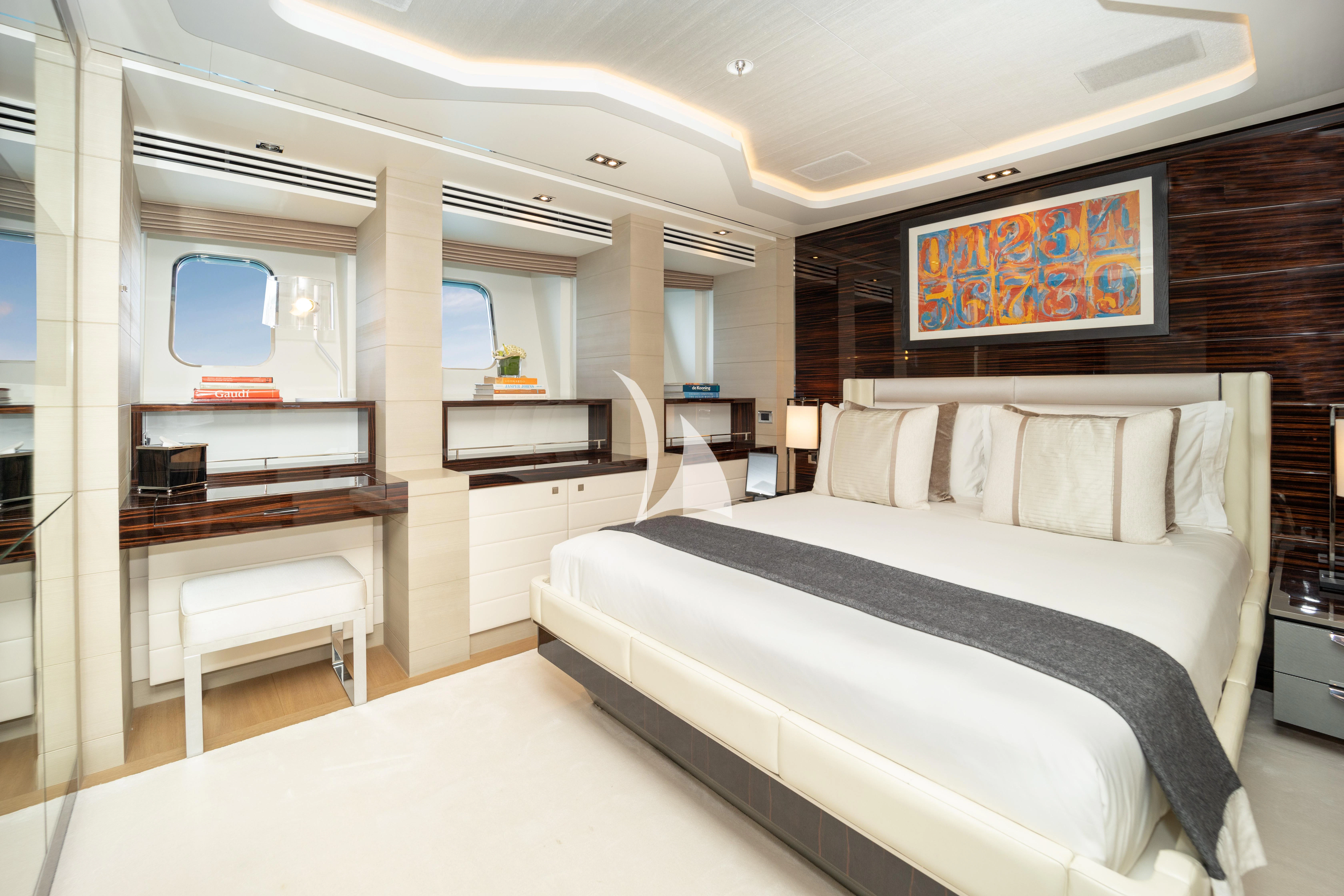 a room with a bed and a desk aboard ILLUSION Yacht for Sale