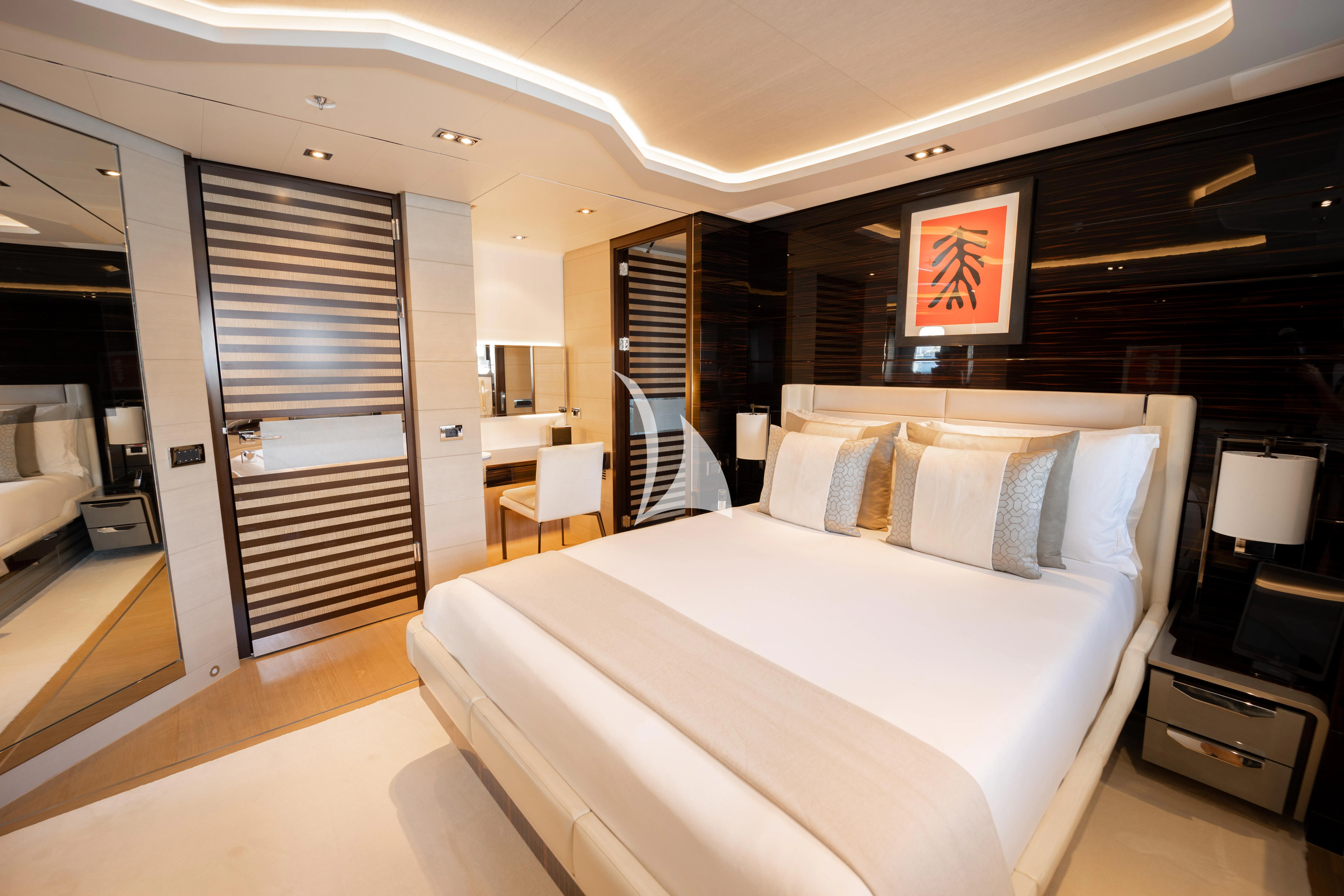 a bedroom with a bed and a ladder aboard ILLUSION Yacht for Sale