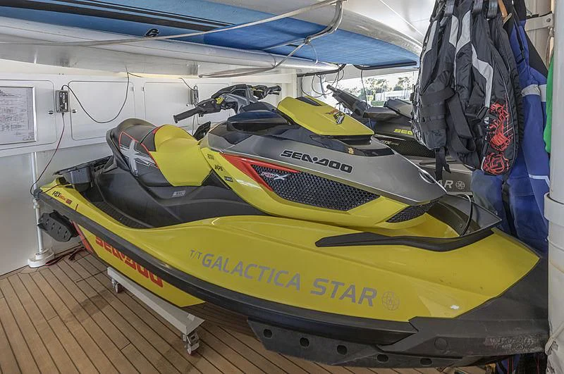 a yellow and black jet aboard ILLUSION Yacht for Sale