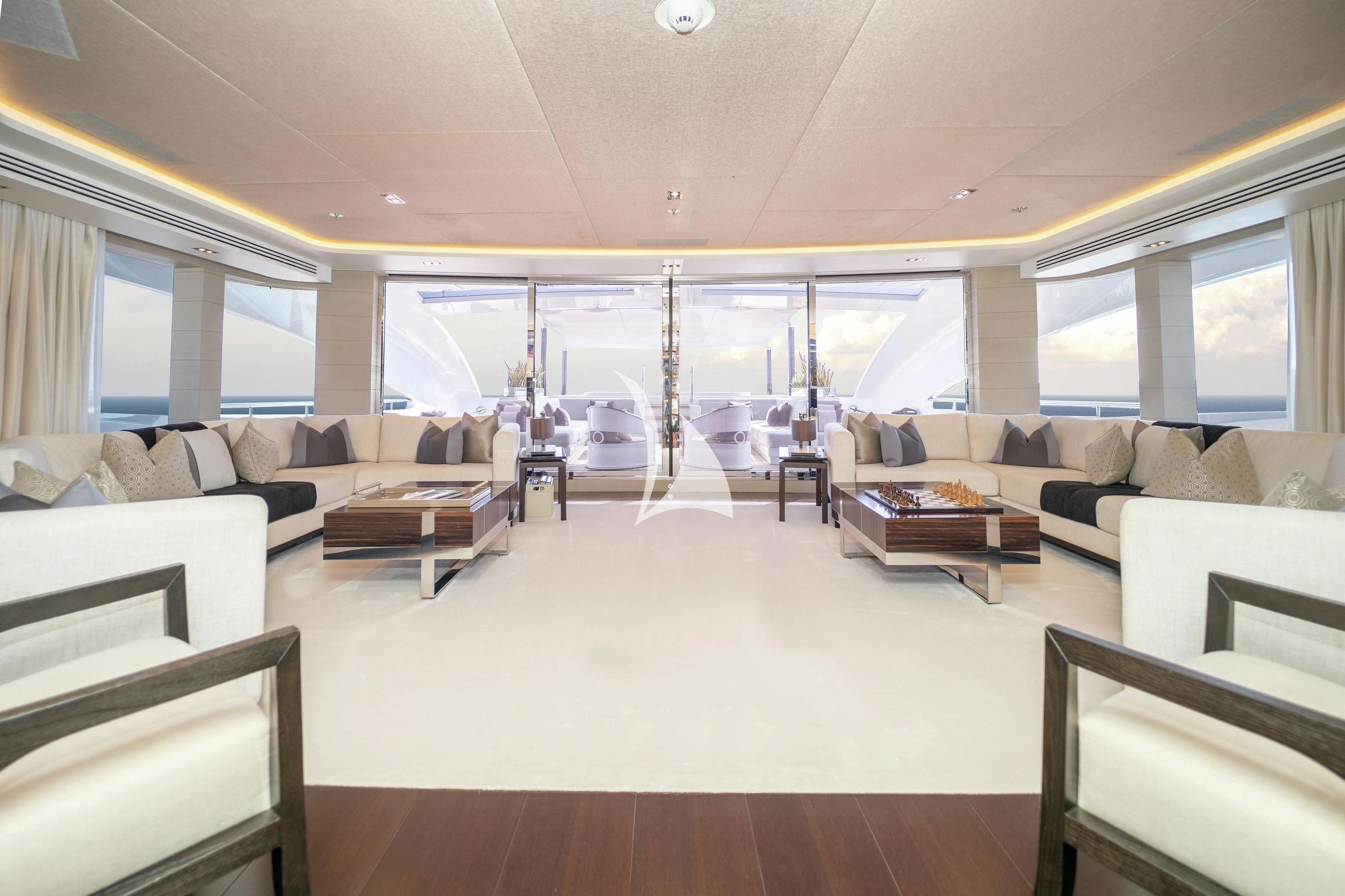 a large living room with a large window aboard ILLUSION Yacht for Sale