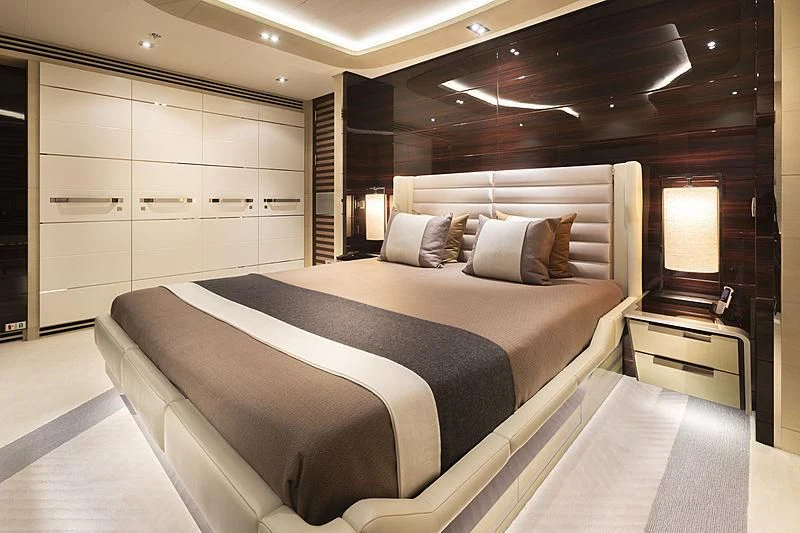 a large bed in a room aboard ILLUSION Yacht for Sale