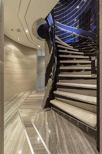a staircase with a metal railing aboard ILLUSION Yacht for Sale