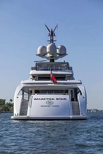 a large white boat on the water aboard ILLUSION Yacht for Sale