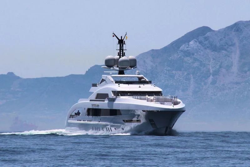 a large white boat in the water aboard ILLUSION Yacht for Sale