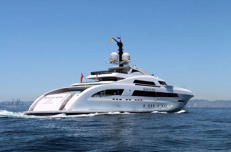 a white yacht on the water aboard ILLUSION Yacht for Sale