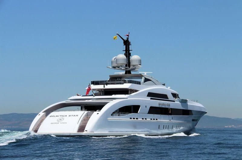 a white yacht in the water aboard ILLUSION Yacht for Sale