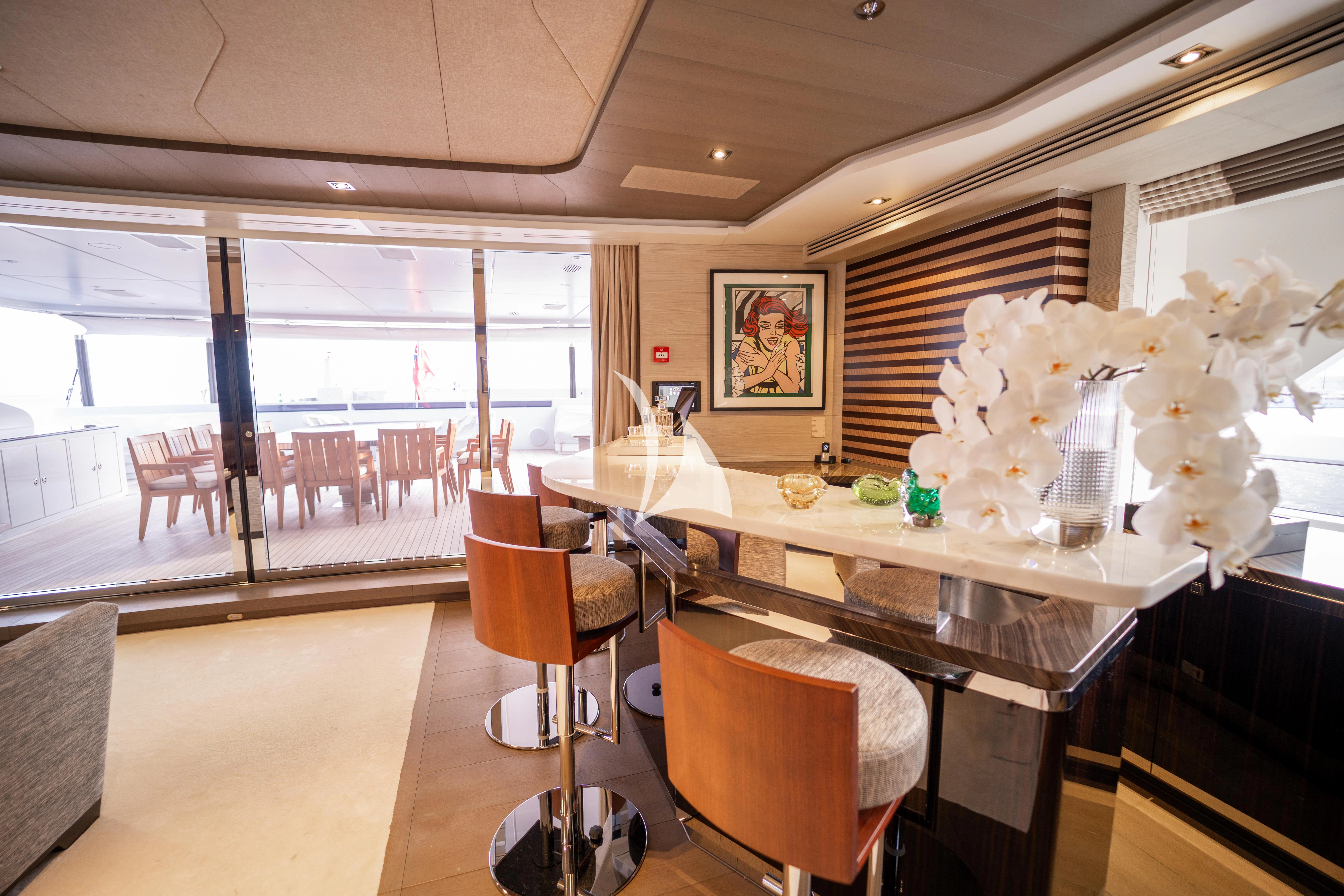 a dining room with a table and chairs aboard ILLUSION Yacht for Sale