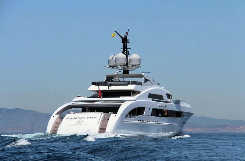 a white boat in the water aboard ILLUSION Yacht for Sale