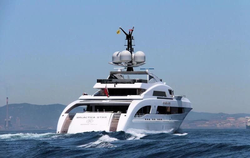 a white boat in the water aboard ILLUSION Yacht for Sale