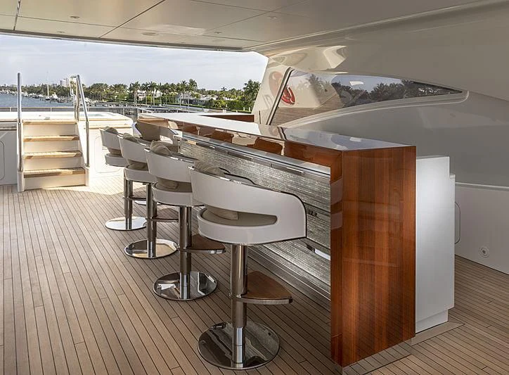 a room with a table and chairs aboard ILLUSION Yacht for Sale