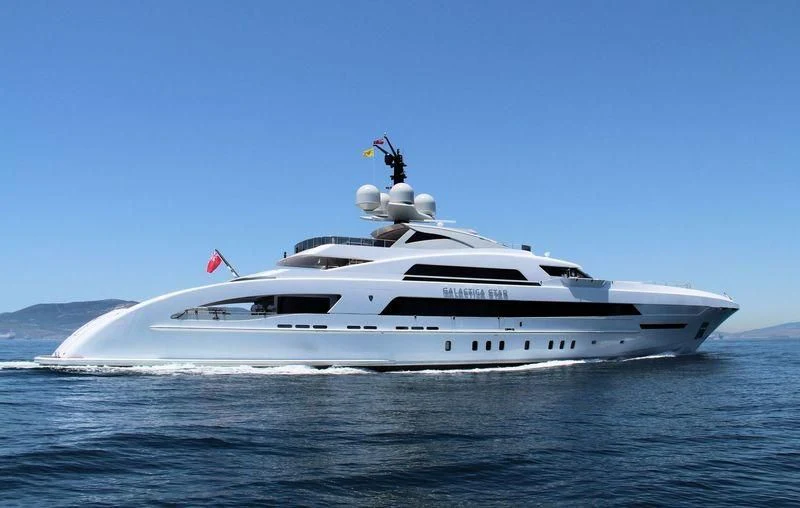 a white yacht on the water aboard ILLUSION Yacht for Sale